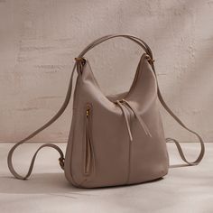 A bestselling convertible bag, Merrin is made for utility with easytoconvert straps turning it into your backpack purse and slouchy shoulder bag. Merrin Convertible Backpack in Pebbled Leather  Taupe BACKPACK in Taupe | Hobo® Convertible Backpack Purse, 2024 Wishlist, Convertible Bags, Convertible Backpack, Cool Backpacks, Backpack Purse, Full Grain Leather, Belt Bag, Pebbled Leather