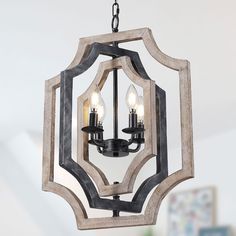 a chandelier with three lights hanging from it's center circle frame and wood accents