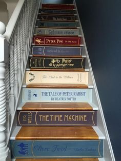 a stair case with books on it and the words woman's own written in red