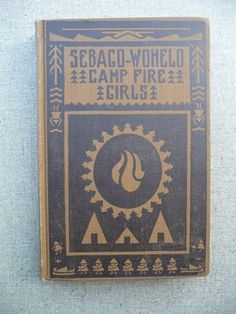 an old book with the title sebac - woeld camp fire girls written on it