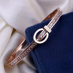 Enhance your style with our premium Voguish Rose Gold Bracelet. This openable bracelet, crafted from stainless steel and adorned with sparkling cubic zircon stones, adds a touch of elegance and sophistication to your wrist. A perfect accessory for any occasion, this bracelet symbolizes love and grace, making it a beautiful gift for yourself or a loved one." Key Features: *Rose Gold Stainless Steel Bracelet *Openable design for easy wear *Embellished with Cubic Zircon stones for added sparkle *Mi Gold Armband, Elegant Bracelet, Rose Gold Bracelet, Steel Bracelet, Chain Link Bracelet, Easy Wear, Stainless Steel Bracelet, Cleaning Clothes, Elegant Style