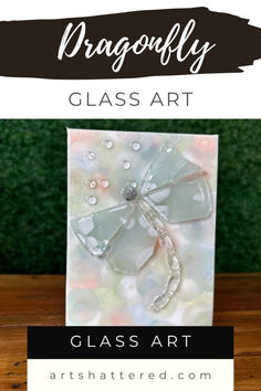 a glass art card with the words dragonfly on it