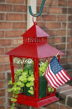 a red lantern with an american flag hanging from it