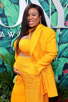 an image of a woman in yellow on the red carpet