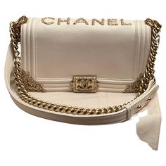 Chanel Cream Calfskin Chateau Versailles Old Medium Boy Bag Gold Hardware, 2013 This bag is lined with beige textile material This piece was featured during the 2013 cruise Versailles ready-to-wear collection Includes dust bag, booklet, authenticity card and box. One of the most beautiful bags made by CHANEL. Chanel Crossbody Bag, Chanel Cream, Chateau Versailles, Chanel Crossbody, Textile Material, Bag Hardware, Girly Bags, Cute Handbags, Art Bag