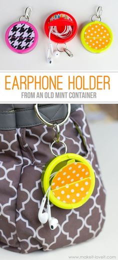 the earphone holder is made from an old mint container and has three different designs on it