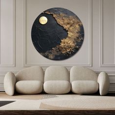 a living room scene with focus on the couch and large circular wall art above it