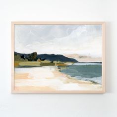 a painting hanging on the wall next to a white wall with an ocean scene in it