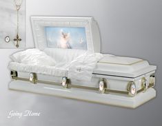 a white casket with an image of a dog in the background and jewelry on display