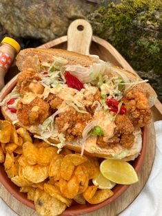 a plate full of fried food and chips