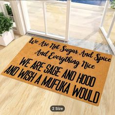 a door mat that says we are the first sign and spice and everything nice, we are sage and hood and wish a mufuka would