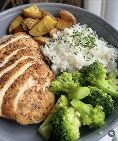 a plate with chicken, rice and broccoli on it is ready to be eaten