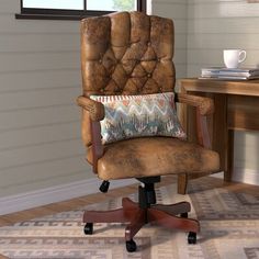 an office chair with a pillow on top of it