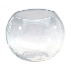 a clear glass vase sitting on top of a white table