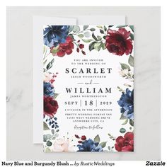 an elegant floral wedding card with red, blue and white flowers on it's front