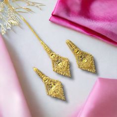 "\"Exclusive Combo Handmade, 1Gram Gold Plated, Fancy, Design & Made by RealGold Jewellery Workers, Partywear, Festival wear, Heavy Long Earrings With Ear Support Chain And Heavy Mangtika. Pack of - 3 (if Jewellery box include then pack of 4) 2 Piece Long Earrings with Ear support Chain 1 Heavy Mangtika 1 Earrings Jewellery Box  Earring Back Pushback Kee Fituter - Handmade, Skin friendly, Real Gold Looking, Fine Gold work by real gold jewellery Workers, long lasting, Party and Festival wear, Long Earrings With Ear support chain and Heavy Mangtika (with Exclusive Jewellery Box). Title Name - Very Beautiful, Real Gold Looking, Fancy, Trendy, Exclusive Design with Real Gold work One gram Heavy Gold Plated Earrings and Mangtika Combo For All Age Girls and Women." Elegant Heavy Gold Plated Earrings, Festive Gold-plated Earrings With Intricate Design, Traditional Jewelry Sets With Matching Earrings, Gold Jewelry Sets With Motifs For Wedding, Gold Wedding Jewelry Sets With Motifs, Heavy Gold Plated Dangle Earrings, Gold Jewelry Sets With Motifs As Gift, Mangtika Jewellery Gold, Wedding Gold Jewelry Sets With Motifs