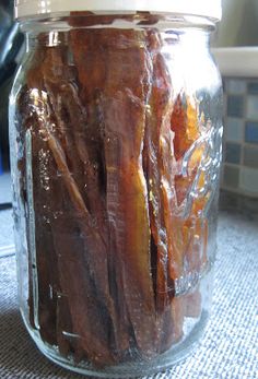 a jar filled with dried fruit sitting on top of a table