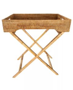 a wicker tray with two crossed legs and a wooden stand on the bottom that holds an empty basket