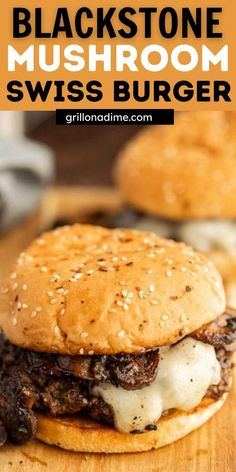 a cheeseburger on a wooden cutting board with the words blackstone mushroom swiss burger