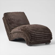 a chair that is made out of brown corded material and sits on a white surface