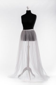 "Tulle overskirt Detachable skirt Tulle Overlay skirt Bridal train Removable tulle skirt Detachable bridal skirt Bridal overskirt This airy tulle overskirt is gorgeous for bride dress Color#1 in our color chart - white color. The skirt is fixed on the waist with a hook-and-loop fastener which is very convenient if you want to remove it. MATERIALS: Tulle: Luxury wedding tulle \"Hayal Tulle\" .Draped, flexible, and very soft and high-quality tulle. Durable and easy to handle. He a thinner and has Elegant Tulle Lined Maxi Skirt, Organza Wedding Skirt With Attached Cancan, Elegant Full Skirt Tulle Bottoms, Wedding Dress With Tulle Skirt And Long Train, Elegant Dress With Lined Tulle Skirt, Elegant Tulle Dress With Lined Skirt, Fitted Wedding Skirt With Sweep Train, Elegant Floor-length Tulle Skirt, Sheer Full Length Wedding Dress