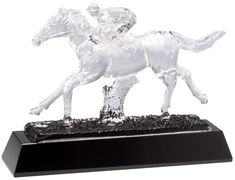 A jockey riding a race horse made completed out of clear crystal. It's mounted on a black crystal base & it includes free engraving & free shipping! Horse Race, The Winner