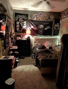 a bedroom with posters on the wall and a bed