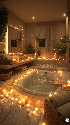 an indoor jacuzzi with candles on the floor and lights in the bathtub