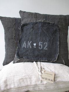 two pillows with the number 522 on them and a price tag attached to one pillow