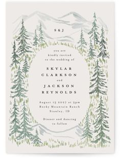 a wedding card with trees and mountains in the background, on top of a white paper