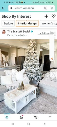 a living room filled with furniture and a christmas tree in the middle of the room