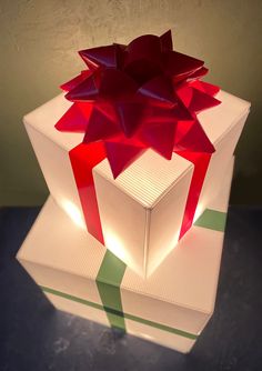 a white box with a red bow on it