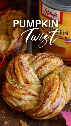 some kind of pastry sitting on top of a wooden table next to a can of pumpkin