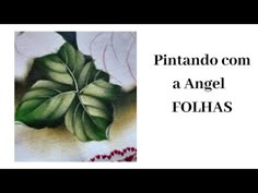 a close up of a painting of leaves on a table cloth with the words pintando com a angel fohas