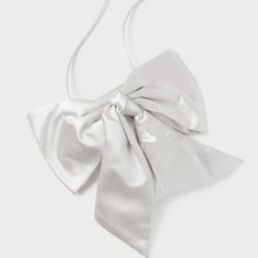 Evening Crossbody Bag In Cream Satin With An Oversized Bow. Features A Magnetic Closure And Lined Interior. Dimensions W: 4.5" X D: 0.5" X H: 7" 20" Strap Drop Materials 72% Viscose 28% Silk Luxury Formal Shoulder Bag With Bow, Elegant Formal Shoulder Bag With Bow, Elegant Evening Bag With Satin Bow, Elegant Evening Bags With Satin Bow, Elegant Formal Bag With Satin Bow, Formal Shoulder Bag With Detachable Bow, Elegant Bags With Bow For Events, Elegant Wedding Bags With Bow Detail, Elegant Wedding Bags With Bow