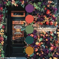 an image of a store front decorated with flowers and pumpkins on the outside wall