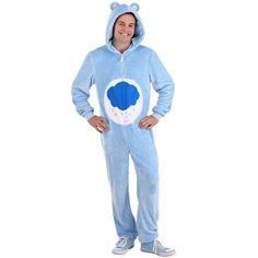 a man in a blue bear onesuit is standing with his hands on his hips