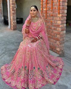 a woman in a pink bridal gown