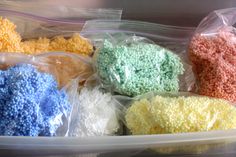 several different colored candies in plastic bags