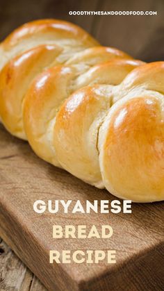 a loaf of bread sitting on top of a wooden cutting board with the words guyanese bread recipe written below it