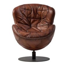 a brown leather chair sitting on top of a metal base