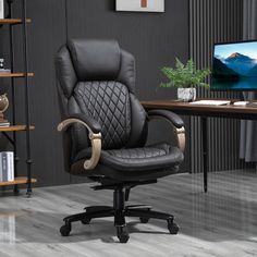 a black office chair sitting in front of a desk with a computer monitor on it