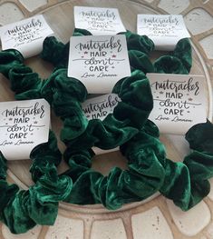 green scrunffles with white tags on them sitting on top of a table