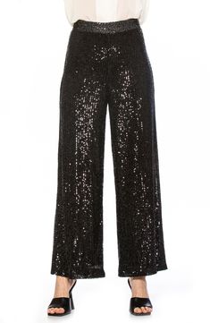 Sparkling sequins bring dazzling allure to a pair of stretch pants that are elevated by a wide leg and mid rise. Banded waist Invisible back zipper 90% polyester, 10% spandex; lining content: 100% polyester Hand wash cold, lay flat to dry Imported Model stats: 5'10", 32" bust, 25" waist, 36" hip. Model is wearing size X-Small. Sequin Stretch Evening Bottoms, Stretch Embellished Bottoms For Evening, Embellished Stretch Bottoms For Evening, Stretch Sequin Bottoms For Evening, Glamorous Embellished Bottoms For Evening, Glamorous Embellished Bottoms For Night Out, Embellished Bottoms For Night Out During Party Season, Glitter Bottoms For Evening And Party Season, Embellished Evening Bottoms For Party Season