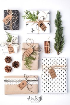 christmas presents wrapped in brown paper and tied with twine, pine cones, fir branches, and tags