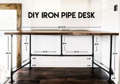 the diy iron pipe desk is made from wood and metal, with measurements on it