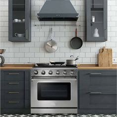 a stove top oven sitting inside of a kitchen