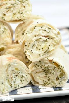 several rolls are stacked on top of each other with dill sprinkles