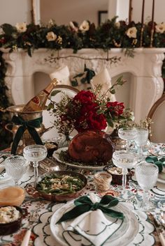 the table is set for christmas dinner