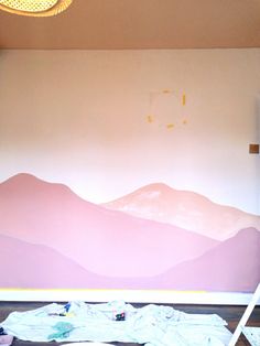 there is a painting on the wall in this room that has been painted with pastel colors